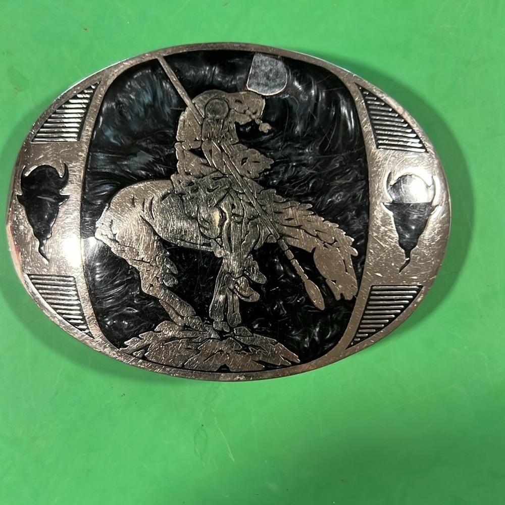 This wonderful belt buckle is ready for a new home cleaning out our closets